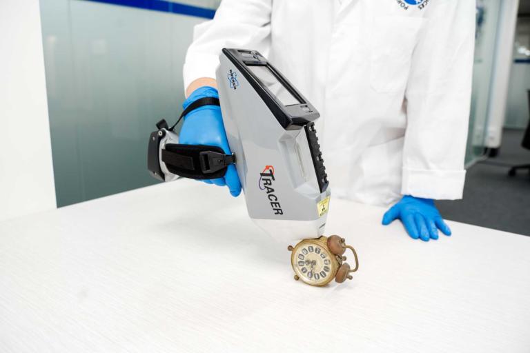 portable XRF analysing old clock